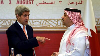 US Secretary of State, John Kerry and the Qatari Minister of Foreign Affairs, Khalid bin Mohammad al-Attiyah during a joint press conference in Doha on 03 August 2015. EPA/STR