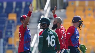 England's Moeen Ali, centre, is congratulated by teammate Tymal Mill, left, after dismissing Bangladesh's Liton Das. AP