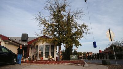 A resident watches as a drone delivers a Covid-19 self collection test kit to her home, after being ordered from Walmart, amid a coronavirus surge in El Paso, Texas. AFP