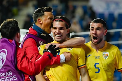 Romania's Ianis Hagi, centre, celebrates with teammates after scoring the winner against Israel. EPA