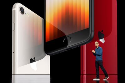 Apple chief executive Tim Cook shows the iPhone SE featuring 5G and the A15 bionic chip. EPA