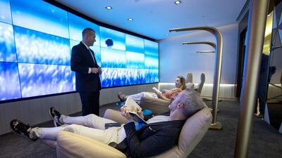 The Relax & Recline area features a large video wall made up of 27 individual screens, soothing sound and lighting, and is furnished with six Poltona Frau leather recliners. Christopher Pike / The National