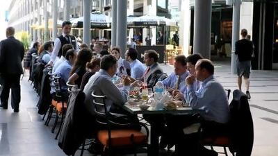 People having lunch at one of the restaurants in DIFC in Dubai. Fewer than a third of those who responded to a recent survey on work-life balance said their employer offered healthy snacks in the workplace cafeteria, compared with 42 per cent globally.