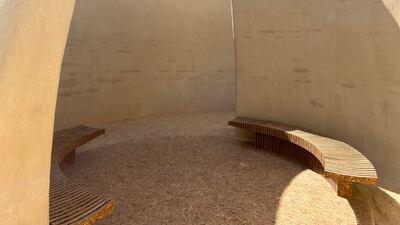 The interior of Sumaya Dabbagh's Earth to Earth, an installation constructed from mud plaster, mud bricks, and reconstituted palm frond boards
