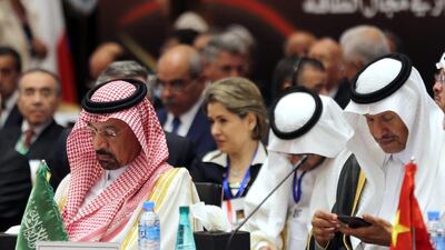 Saudi energy minister Khalid Al Falih, left, attends attends the International Energy Forum in Algiers. Mr Falih said record global stocks of oil had started to decline. Mohamed Messara / EPA