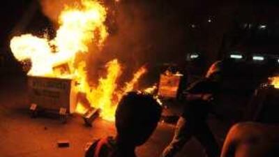 Protesters set rubbish bins on fire during clashes in Bilad Al Qadeem village on the outskirts of the Bahraini capital Manama on Monday.