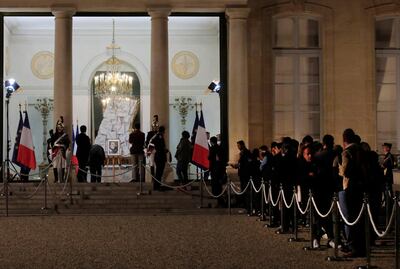 People queue to sign the book of condlonce for Jacques Chirac at the Elysee Palace. AP Photo