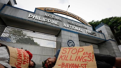 Filipino demonstrators mimic victims at an extrajudicial killing crime scene during a protest in front of the Philippine National Police (PNP) headquarters in Camp Crame, Quezon City, northeast of Manila, Philippines on August 26, 2016. According to police data, at least 756 people were slain during anti-drug police operations and 1,160 more deaths were committed by still unknown assailants based on a tally from July 1 to August 23. Mark E Cristino/EPA