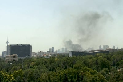 Smoke rises over Tehran after air strikes in June 2025 that Israel said struck IRGC sites and Evin prison. AFP