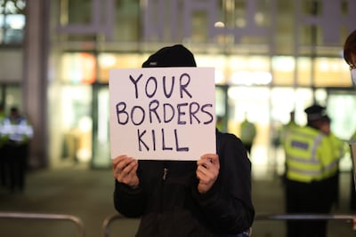 People take part in a protest in November 2021 outside the Home Office in Westminster, London. PA