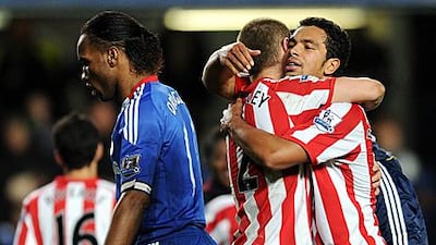Sunderland pair Phil Bardsley, centre, and Kieran Richardson hug after inflicting a 3-0 defeat on Chelsea on Sunday.