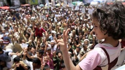 A girl makes her feelings plain about victory for the protesters during an anti-government rally to demand the ousting of Yemen's President Ali Abdullah Saleh in Sanaa yesterday. Ahmed Jadallah / Reuters