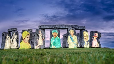 Images of Queen Elizabeth from each decade of her reign, projected on to Stonehenge in Wiltshire, to mark her platinum jubilee. PA