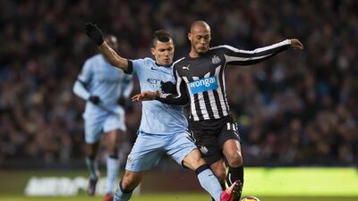 Sergio Aguero, left, and Manchester City had no problem getting past Yoan Gouffran and Newcastle United on Saturday at the Etihad Stadium. Jon Super / AP Photo