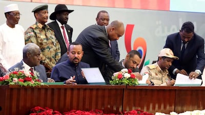 Sudan's Forces of Freedom and Change coalition leader Ahmad Rabiah (3-R) and Sudan's General and Vice President of Sudanese Transitional Military Council, Mohamed Hamdan Dagalo (2-R) sign power-sharing agreement,. EPA