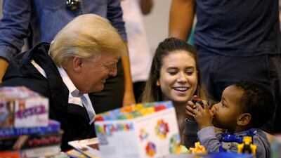 U.S. President Donald Trump visits with survivors of Hurricane Harvey at a relief center in Houston, Texas, U.S., September 2, 2017. REUTERS/Kevin Lamarque