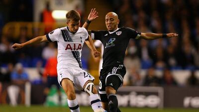 Tommy Carroll of Tottenham Hotspur protects the ball from Richard Almeida de Oliveira of Qarabag on Thursday night during their Europa League contest. Bryn Lennon / Getty Images