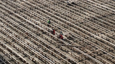 Men work at a construction site in Seoul, South Korea. AP Photo