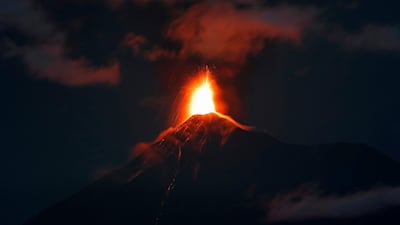 The Volcan de Fuego, or Volcano of Fire, spews hot molten lava from its crater in Antigua, Guatemala, early Monday, Nov. 19, 2018. AP