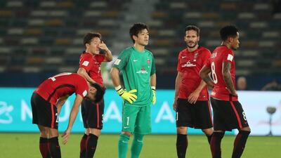 Shusaku Nishikawa of Urawa Red Diamonds and his team-mates look dejected at the end of the FIFA Club World Cup UAE 2017 match between Al Jazira and Urawa Red Diamonds at Zayed Sports City Stadium on December 9, 2017 in Abu Dhabi, United Arab Emirates. (Photo by Matthew Ashton - AMA/Getty Images)