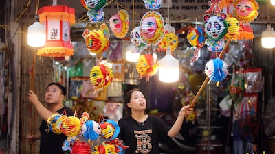 Vendors sell decorations for the Mid-Autumn Festival on a street in Hanoi, Vietnam. Also known as the Moon Festival, the celebrations involve lion dancers, lantern processions and mooncakes. This year the festival falls on September 10. EPA