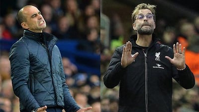 Before Liverpool manager Jurgen Klopp, right, and Everton manager Roberto Martinez can dream of lifting the League Cup next month, they will need to negotiate tricky second legs on Tuesday and Wednesday. AFP PHOTO / PAUL ELLIS and LINDSEY PARNABY