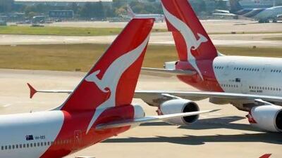 Qantas aircraft on the tarmac at Sydney's International Airport. Today, Emirates has more flights on the Australia-Europe route than Qantas. Greg Wood / AFP