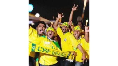 Brazil fans enjoy the party vibe as they get ready for a friendly with England in Doha.