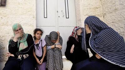 Displaced Palestinian women sit in a Greek Orthodox church where many Palestinians are taking shelter in Gaza City on July 23, 2014. AFP Photo