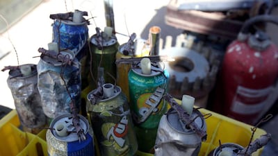 Grenades made from drink cans, which were used against Muammar Qaddafi’s forces during the Libyan uprising, are displayed. Larger, more sophisticated weapons such as Soviet-made anti-aircraft missiles have also been collected. Mahmud Turkia / AFP Photo