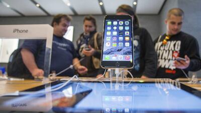 People try out the newly released iPhone 6 in Berlin. Hannibal / Reuters