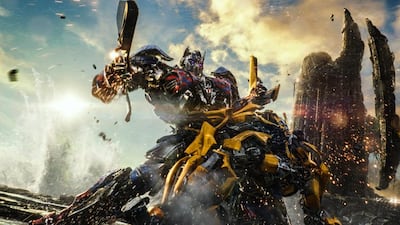 This image released by Paramount Pictures shows Optimus Prime and Bumblebee, foreground, in a scene from, "Transformers: The Last Knight." (Paramount Pictures/Bay Films via AP)