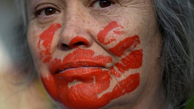 A woman takes part in a protest in front of the Iranian embassy in Mexico City against the death sentence handed to Iranian footballer Amir Nasr-Azadani. AFP