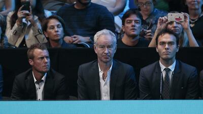 Lleyton Hewitt, John McEnroe and Ross Hutchins watch Andy Murray in action against Rafael Nadal. Suzanne Plunkett / Reuters