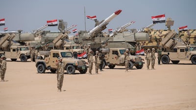 Members of the Egyptian Armed Forces stand at attention for the inspection during the inauguration of the Mohamed Naguib Military Base. Rashed Al Mansoori.