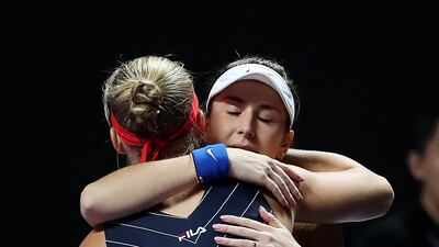 Kiki Bertens is consoled by Belinda Bencic of Switzerland after her withdrawal from their WTA Finals match at the Shenzhen Bay Sports Center. Getty Images