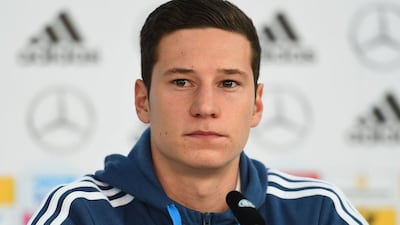 Germany midfielder Julian Draxler addresses questions at a press conference in Essen, Germany on Monday ahead of a Tuesday Euro 2016 qualifier against Ireland. Lars Baron / Bongarts / Getty Images / October 13, 2014