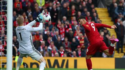 Kasper Schmeichel of Leicester City saves the ball from Firmino. Getty