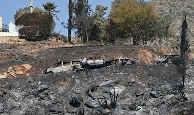View of burned-out vehicles in Beda village, Almeria, southern Spain. EPA
