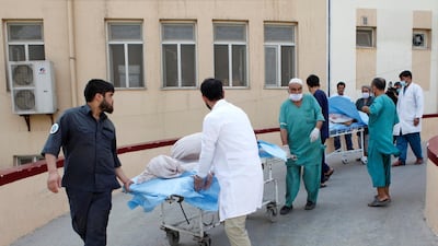 Hospital workers transfer injured people for treatment after a truck bomb blast in Balkh province, in Mazar-i-Sharif, Afghanistan. Reuters