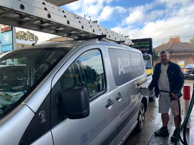 Alex Berry fills up his tank at Texaco in Wandsworth Road, south-west London. He was more than an hour late for work due to huge queues at the station. Laura O'Callaghan / The National
