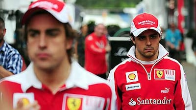 Fernando Alonso, left, can still win the championship but Felipe Massa's tilt is all but over.