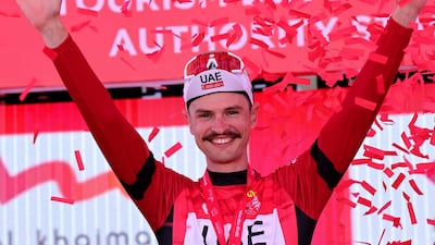 UAE Team Emirates rider Jay Vine celebrates after becoming the new race leader. AFP
