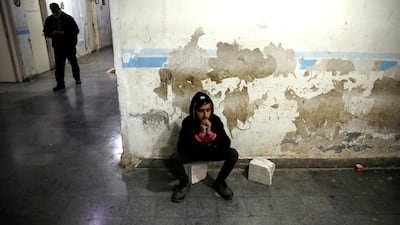 A relative of a wounded fighter waits for the end of his surgery in a hospital in Idlib, Syria. REUTERS