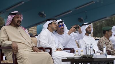 From left: Sheikh Saeed bin Mohammed Al Nahyan, Sheikh Mansour bin Zayed, Deputy Prime Minister and Minister of Presidential Affairs, Sheikh Hazza bin Zayed, Vice Chairman of the Abu Dhabi Executive Council, Sheikh Mohammed bin Saud Al Qasimi, Crown Prince and Deputy Ruler of Ras Al Khaimah, and Lt Gen Hamad Thani Al Romaithi, Chief of Staff, Armed Forces, attend the military exercise. Rashed Al Mansoori / Crown Prince Court - Abu Dhabi