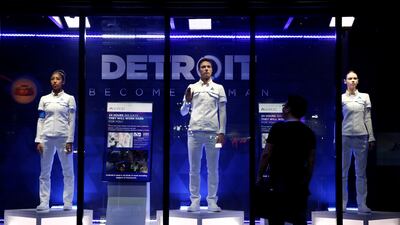 A man looks at models of android robots in Chiba, east of Tokyo, Japan. Kim Kyung-Hoon/Reuters