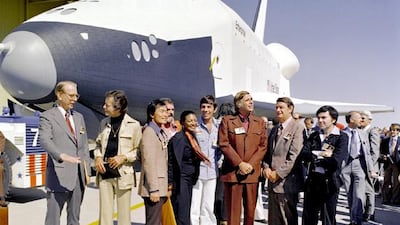 1976: The Space Shuttle Enterprise rolls out of the Palmdale manufacturing facilities with Star Trek television cast members. Left to right: Dr. James D. Fletcher, NASA Administrator, DeForest Kelley (Dr. "Bones" McCoy), George Takei (Mr. Sulu), James Doo???