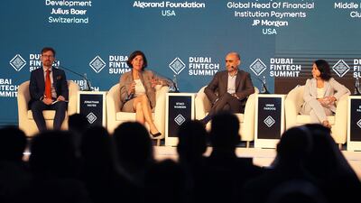 (Left to right) Jonathan Hayes from Julius Baer; Staci Warden from Algorand Foundation; Umar Farooq from Onyx by JP Morgan and Ebru Pakcan from Citi UAE attend a panel discussion at the Dubai FinTech Summit on Monday. Pawan Singh / The National