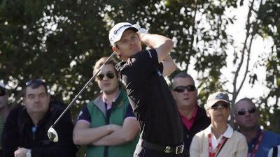 Justin Rose watches his drive on the 17th at the Abu Dhabi HSBC Golf Championship on Friday. He finished the second round 8-under and sits atop the leader board.