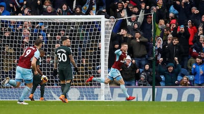Johann Berg Gudmundsson celebrates scoring Burnley's equalising goal against Manchester City. Jason Cairnduff / Reuters